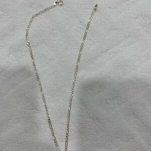 Silver necklace with little  bear pendant.
